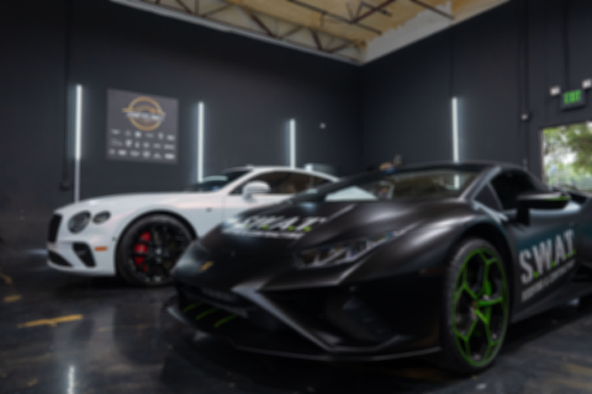 Lamborghini Huracan and Bentley Continental in the shop