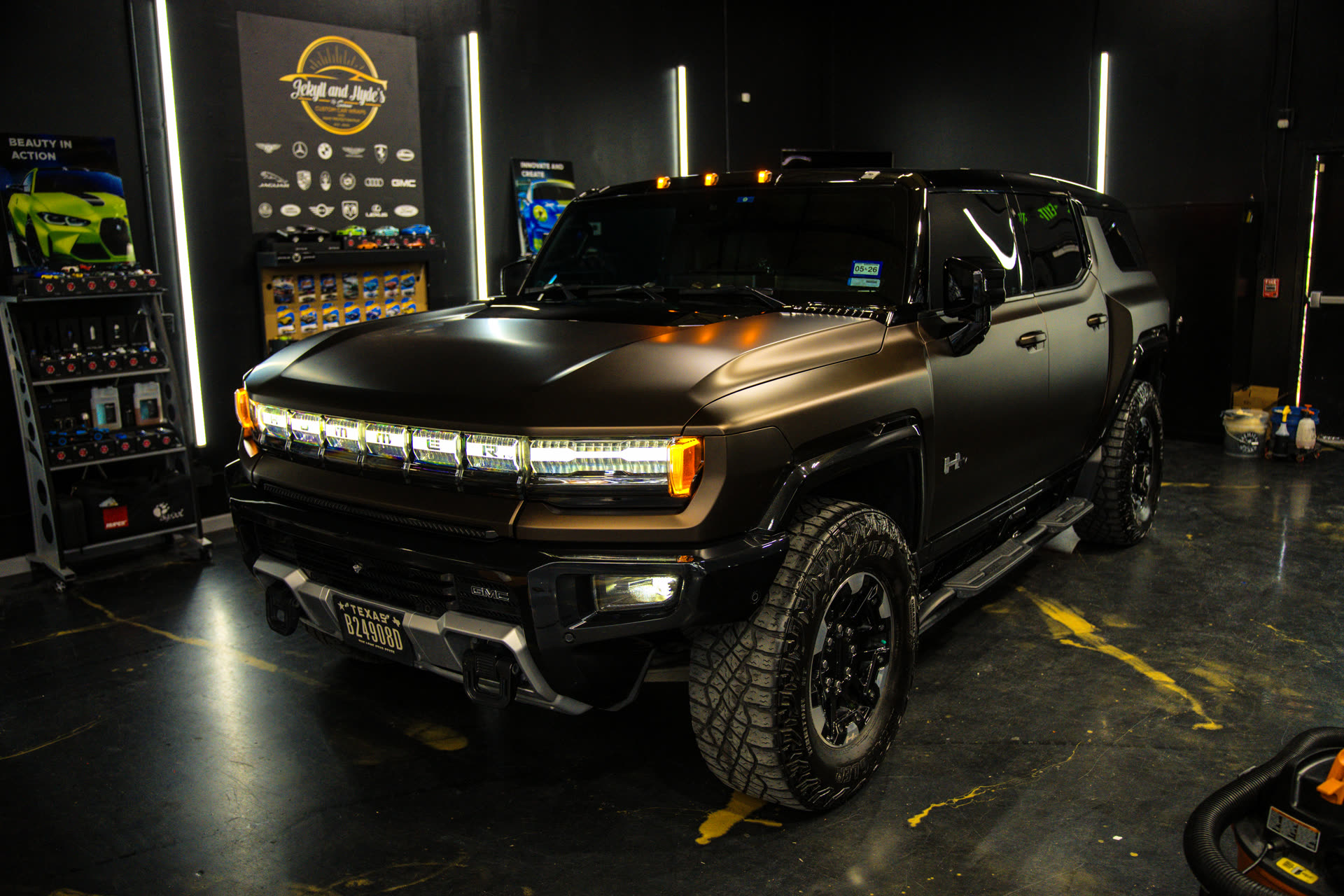 Hummer EV in a matte wrap under shop lights